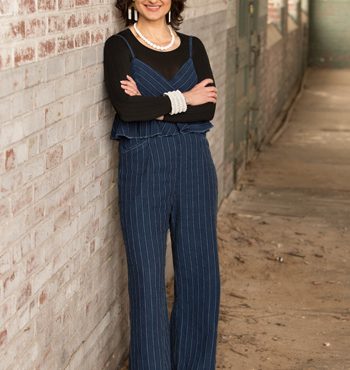 Bethany Zitlaw loan officer standing next to wall